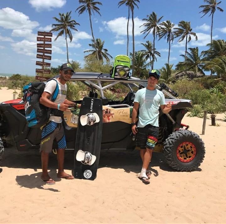 A child in a swimsuit and a towel on the beach